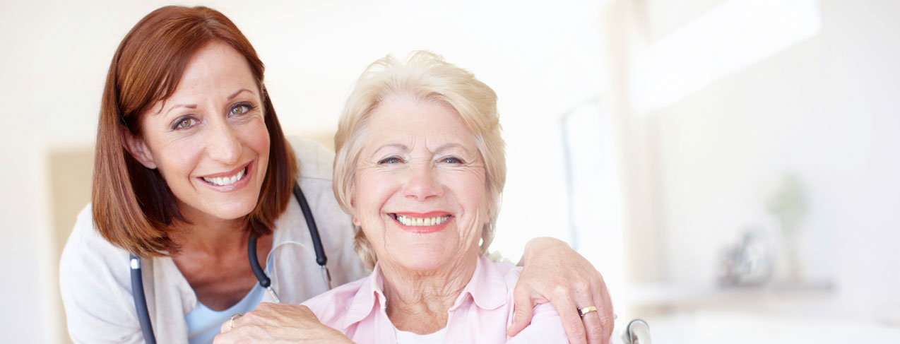 Care Provider and Woman Smiling