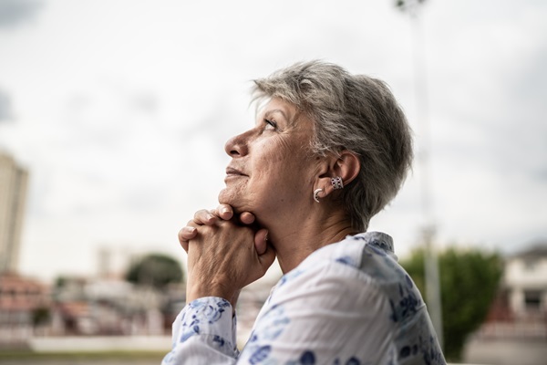 Contemplative senior woman looking away outdoors