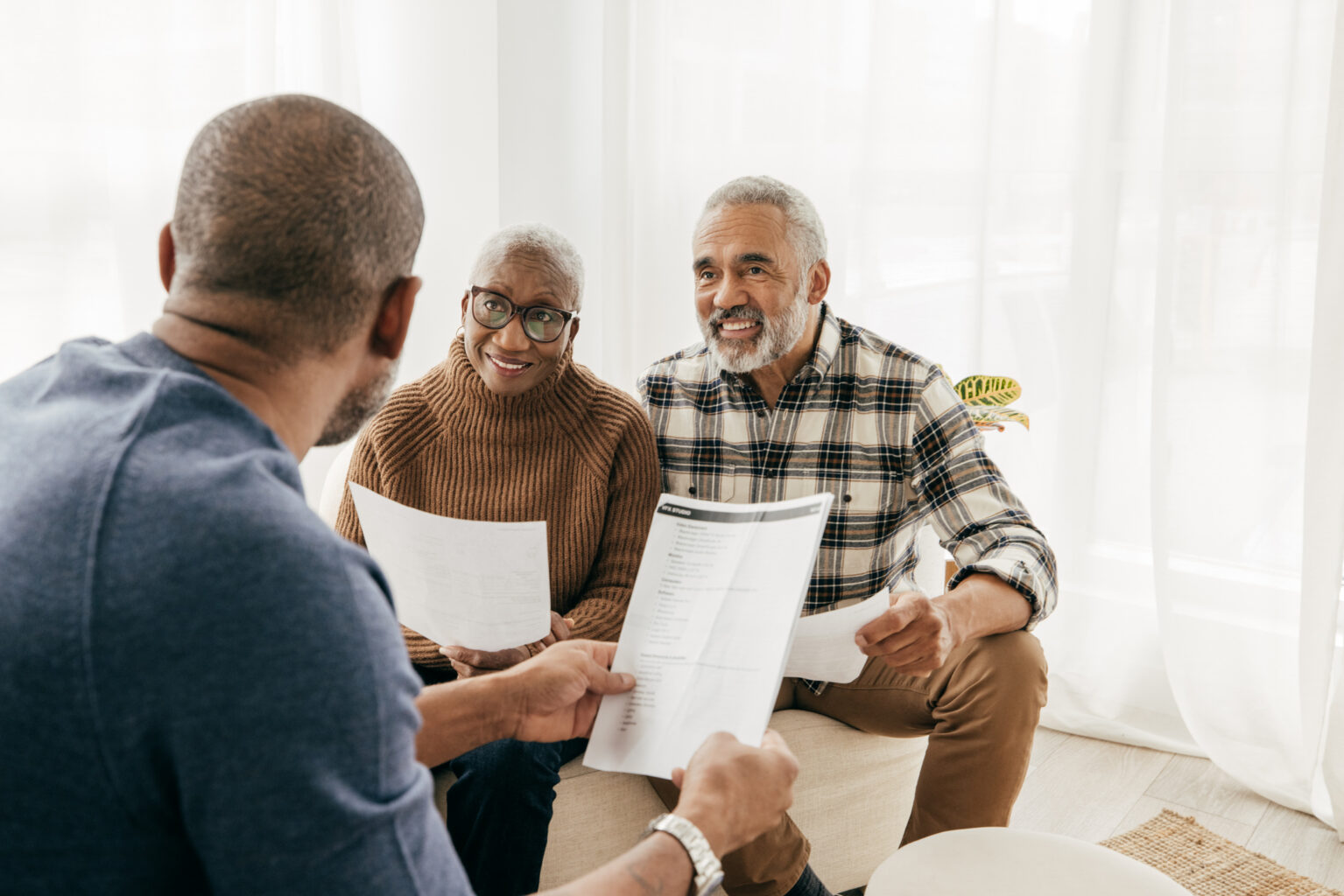 Close up of a senior couple getting help from a Real Estate Agent