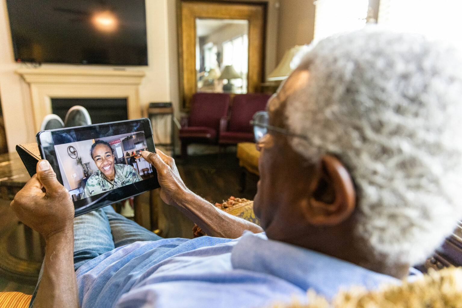 A father talks to his daughter on video chat